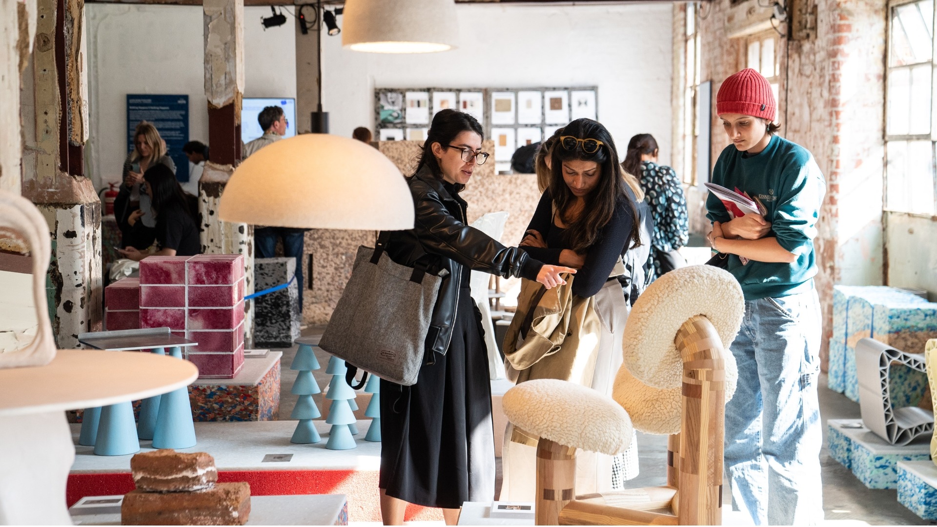 Visitors at a previous Material Matters fair looking at products and furniture